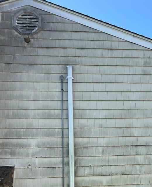 Before: siding dulled by mildew and grime