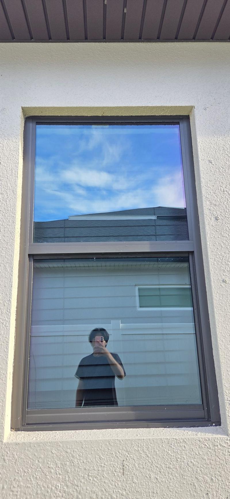 Exterior window reflecting blue sky after cleaning