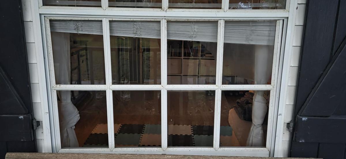 Clear window between black shutters after cleaning