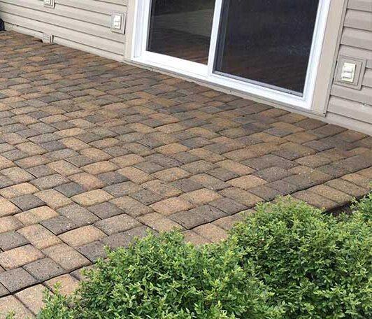 After: the same pavers after pressure washing