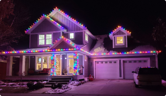 Florida home decorated with colorful holiday lighting on the entire exterior